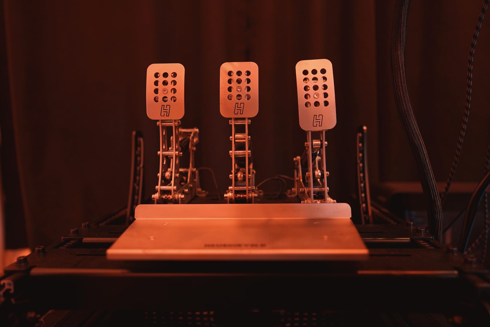 Heusinkveld Sim Pedals Ultimate+ on the machined baseplate